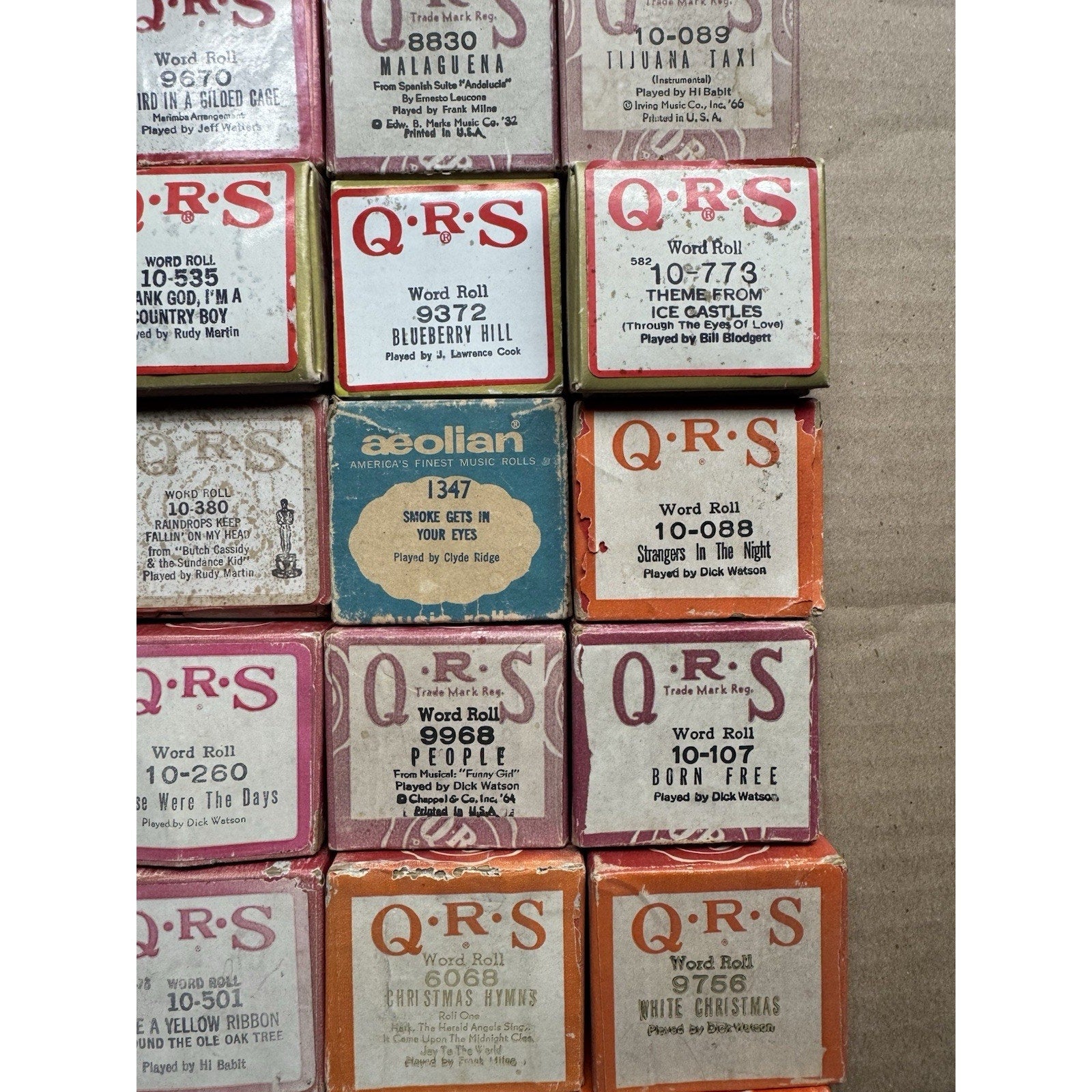 VINTAGE QRS WORD ROLL PIANO PLAYER MUSIC ROLLS LOT OF 34 ROLLS MELODEE SONGS