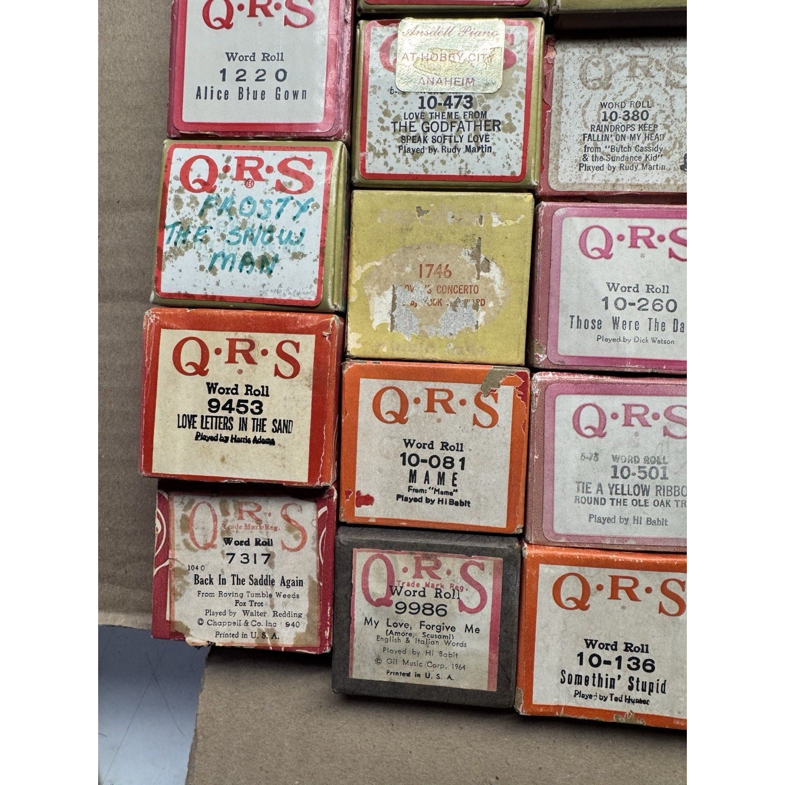 VINTAGE QRS WORD ROLL PIANO PLAYER MUSIC ROLLS LOT OF 34 ROLLS MELODEE SONGS