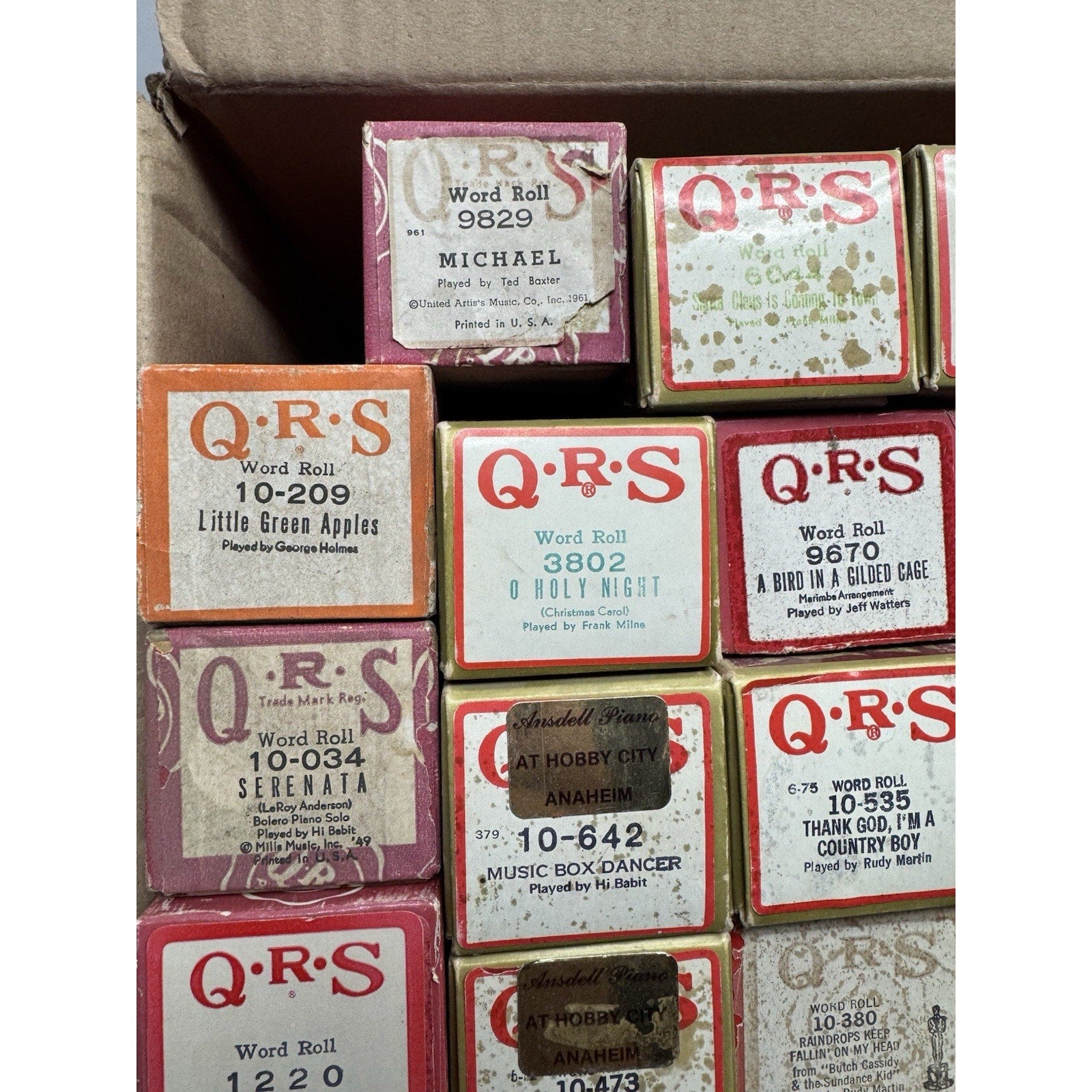 VINTAGE QRS WORD ROLL PIANO PLAYER MUSIC ROLLS LOT OF 34 ROLLS MELODEE SONGS