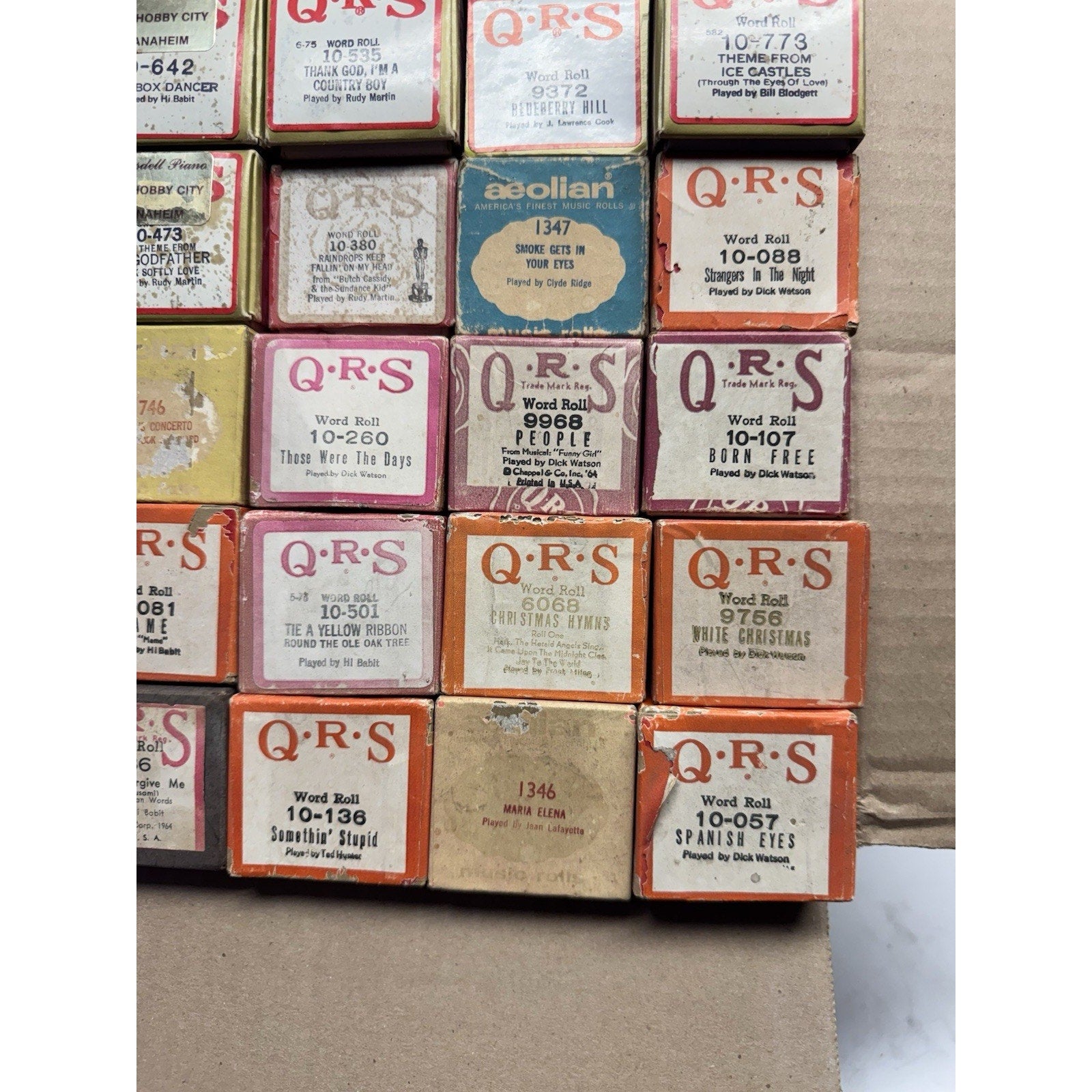 VINTAGE QRS WORD ROLL PIANO PLAYER MUSIC ROLLS LOT OF 34 ROLLS MELODEE SONGS